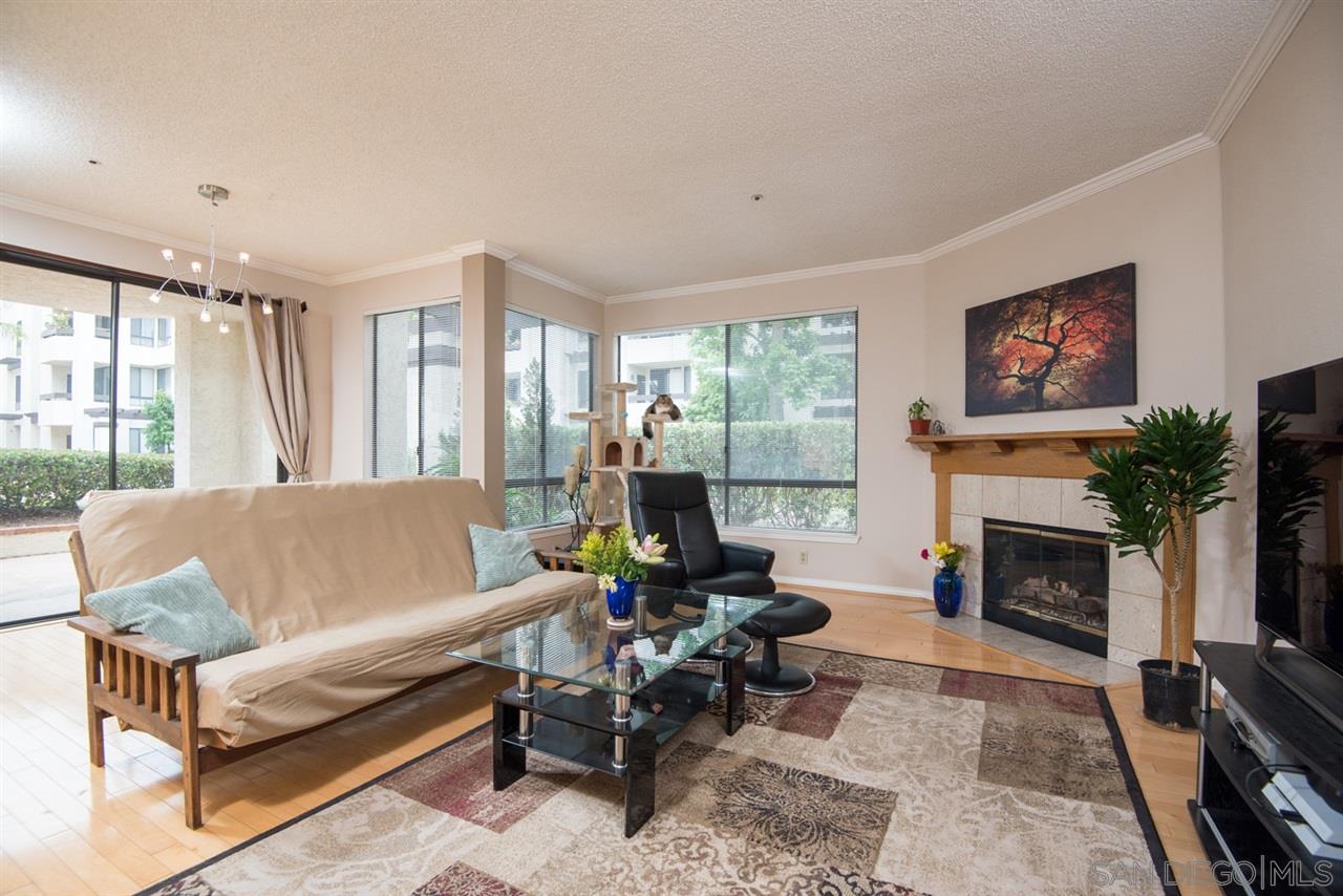 5805 Friars Road, Unit 2101 San Diego, CA 92110 - Photo 1 of 25 A view towards the fireplace, dining area and slider out to the large outdoor patio.