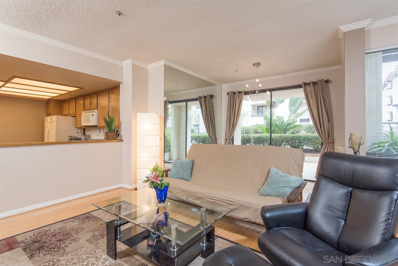 5805 Friars Road, Unit 2101 San Diego, CA 92110 - Photo 2 of 25 Looking out back to the kitchen and the dining area.