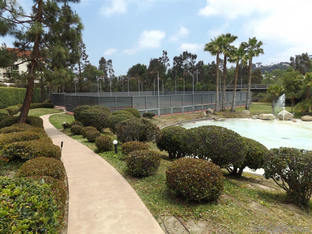 5805 Friars Road, Unit 2101 San Diego, CA 92110 - Photo 16 of 25 A view from the garden-like landscaping at the rear of the expansive property looking to ward the tennis courts over one fo the decorative ponds.