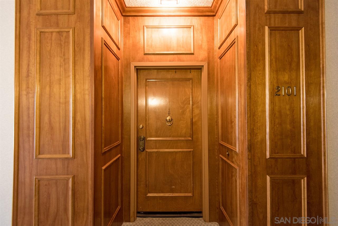 5805 Friars Road, Unit 2101 San Diego, CA 92110 - Photo 19 of 25 Classical wooden entry to the unit immediately inside the locked building door.