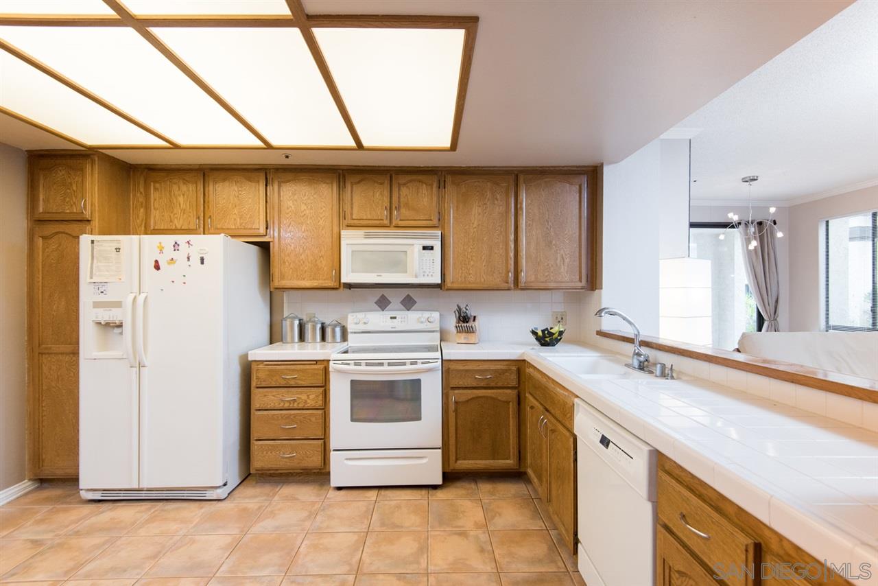 5805 Friars Road, Unit 2101 San Diego, CA 92110 - Photo 5 of 25 Lots of counter space and room to move opening to the living room.