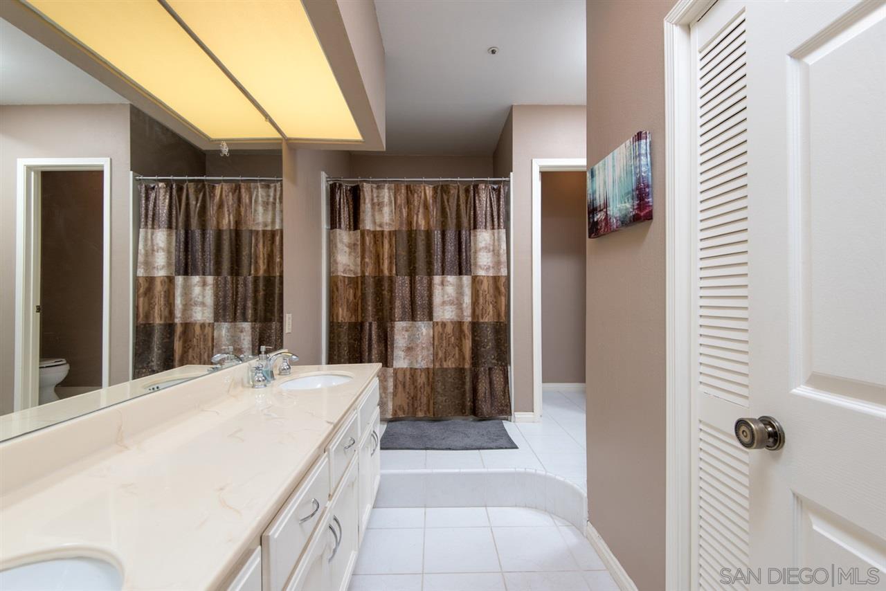 5805 Friars Road, Unit 2101 San Diego, CA 92110 - Photo 7 of 25 Long vanity, two closets one being a walk-in, step up to the tub/shower and closeted commode.