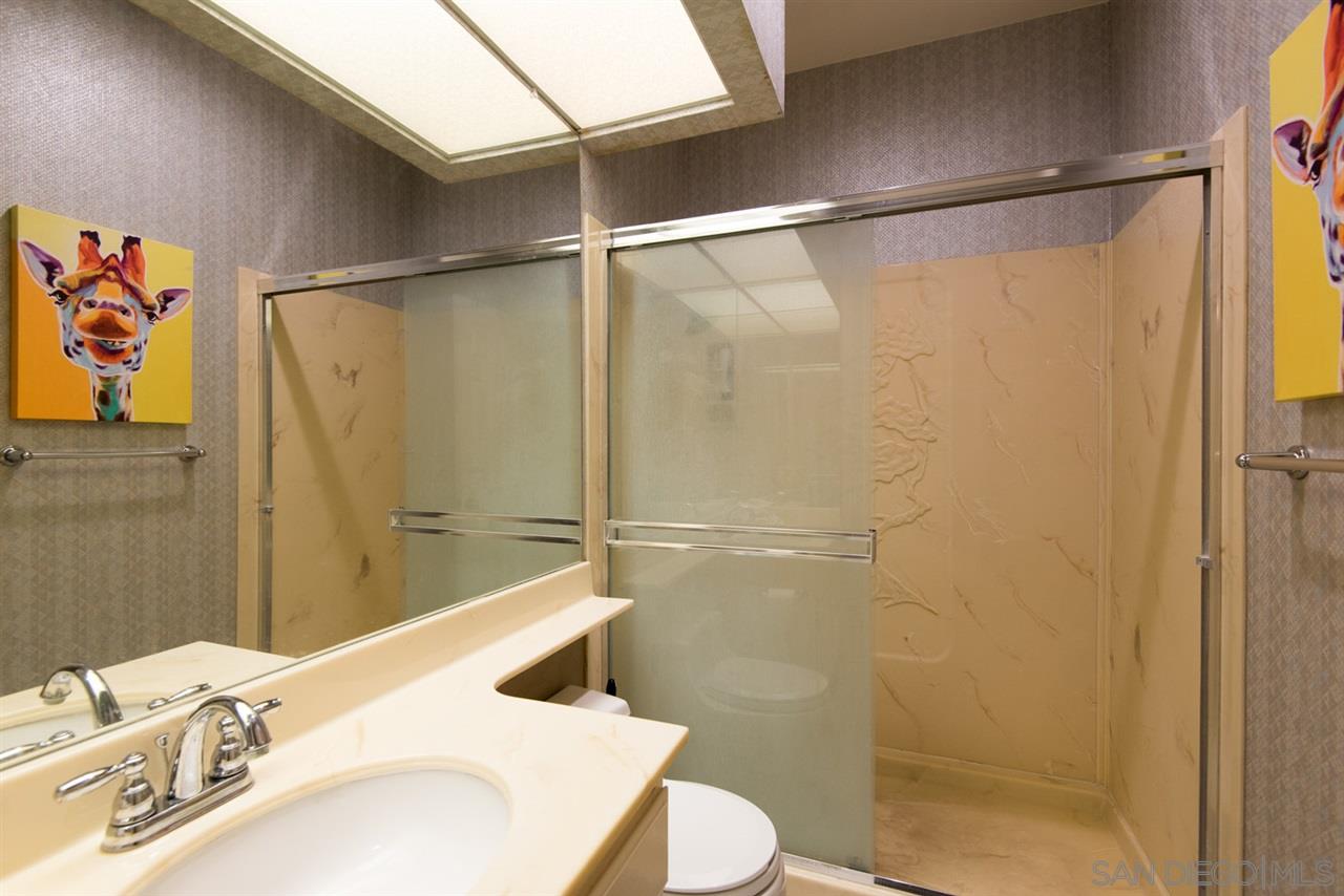 5805 Friars Road, Unit 2101 San Diego, CA 92110 - Photo 9 of 25 Hallway bathroom serving both guests and second bedroom.