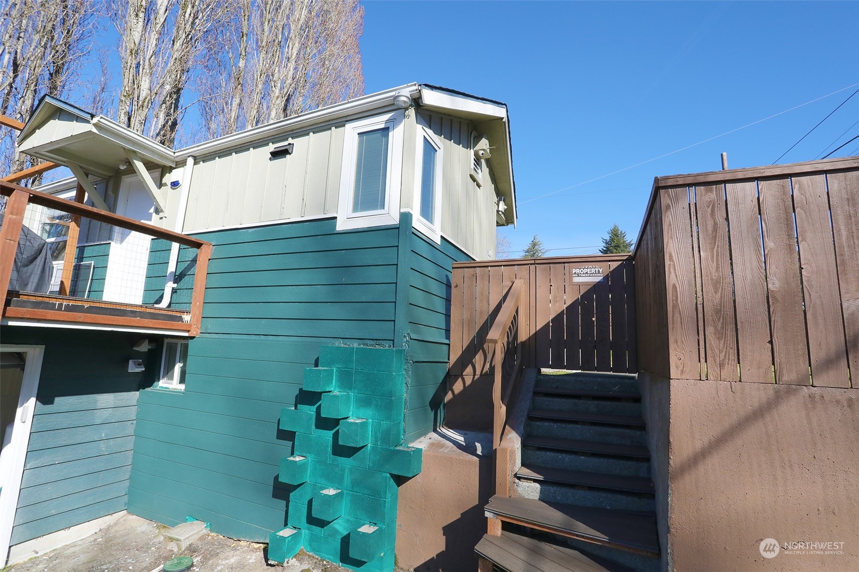 2819 Pine Road Northeast Bremerton, WA 98310 - Photo 8 of 29 a front view of a house with wooden stairs