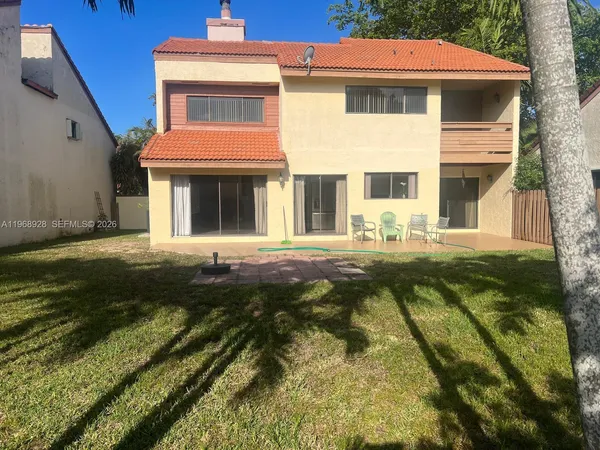 a view of a backyard with a trampoline