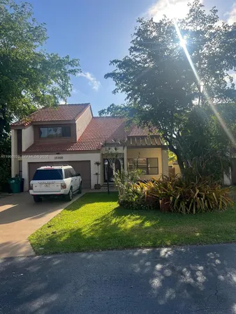 a view of a house with a yard porch and sitting area