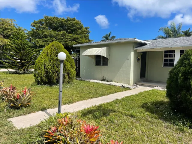 a view of a backyard of the house