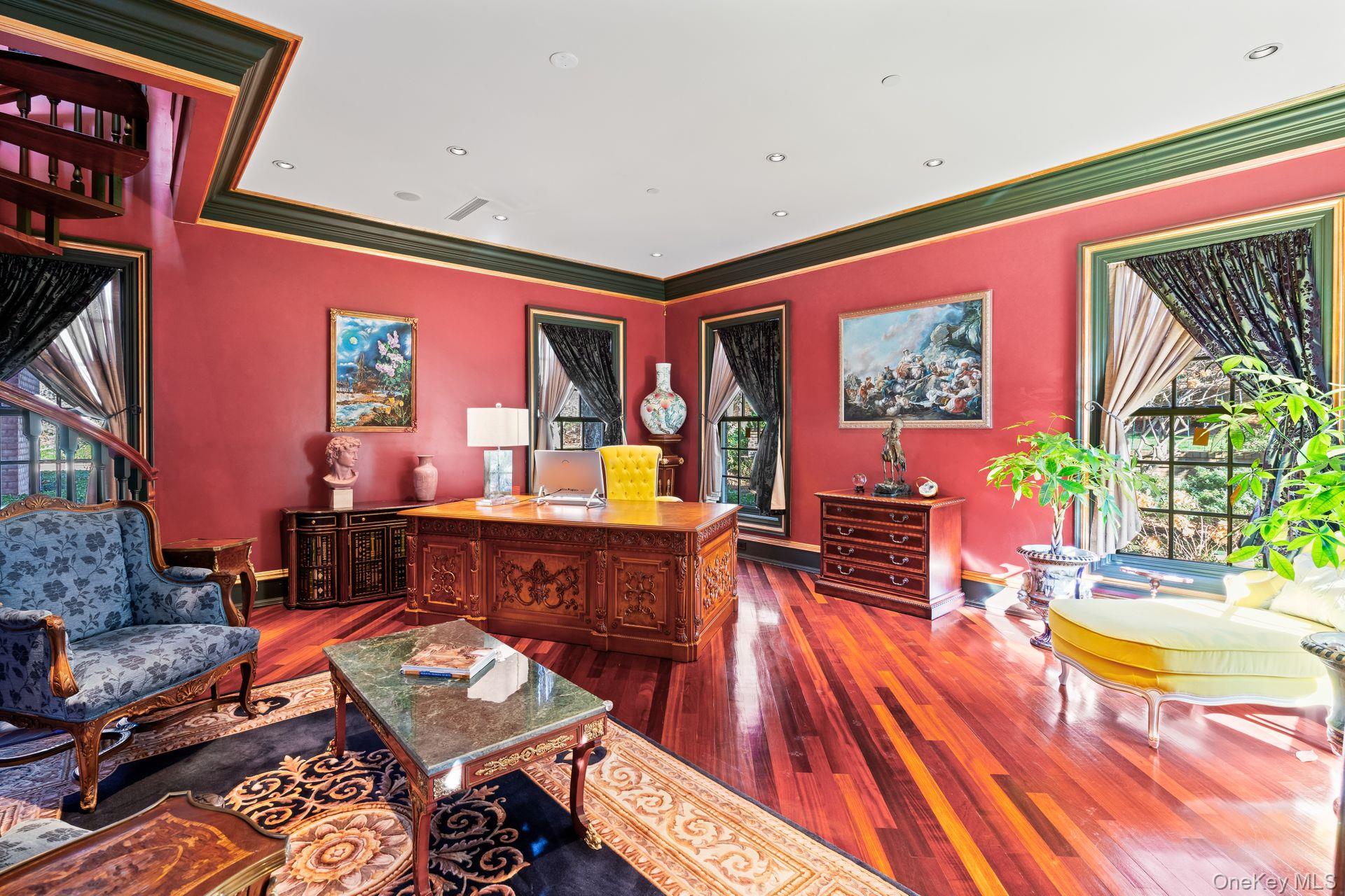 660 Chicken Valley Road Locust Valley, NY 11560 - Photo 10 of 48 a living room with furniture a rug and a painting on the wall