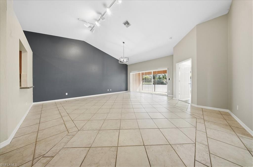430 St Andrews Boulevard, Unit 6 Naples, FL 34113 - Photo 11 of 47 a view of an empty room and window