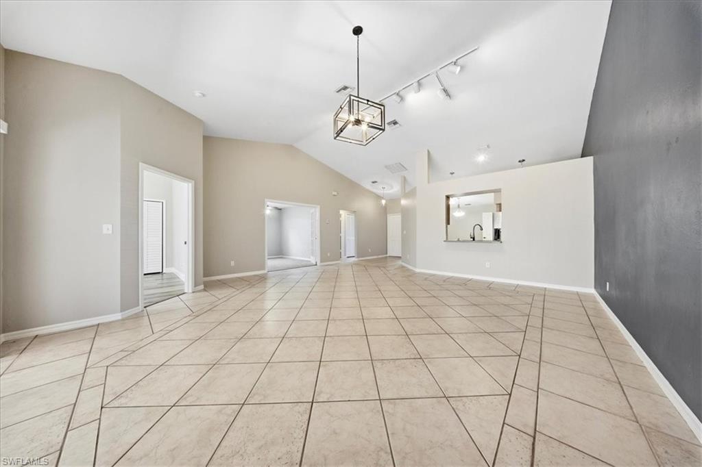 430 St Andrews Boulevard, Unit 6 Naples, FL 34113 - Photo 12 of 47 a view of an empty room and window