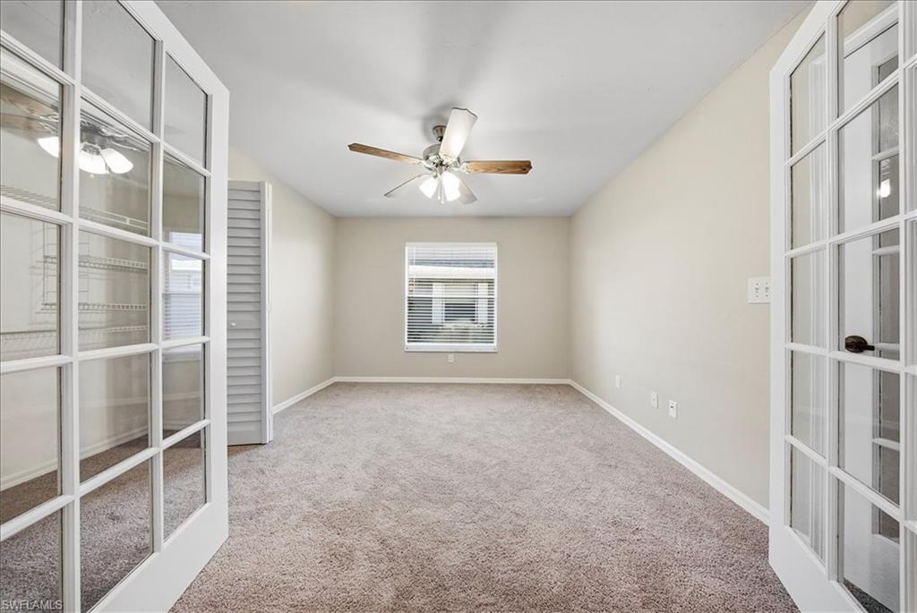 430 St Andrews Boulevard, Unit 6 Naples, FL 34113 - Photo 23 of 47 a view of an empty room with a window