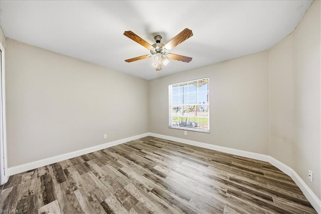 430 St Andrews Boulevard, Unit 6 Naples, FL 34113 - Photo 25 of 47 a view of an empty room with a window