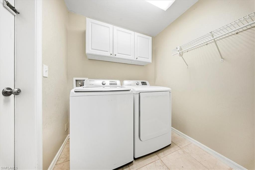 430 St Andrews Boulevard, Unit 6 Naples, FL 34113 - Photo 28 of 47 a utility room with dryer and washer