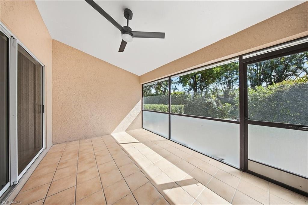 430 St Andrews Boulevard, Unit 6 Naples, FL 34113 - Photo 34 of 47 a view of a hallway with windows
