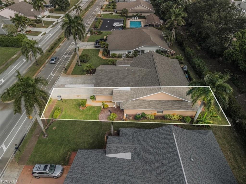 430 St Andrews Boulevard, Unit 6 Naples, FL 34113 - Photo 38 of 47 an aerial view of a house with a yard