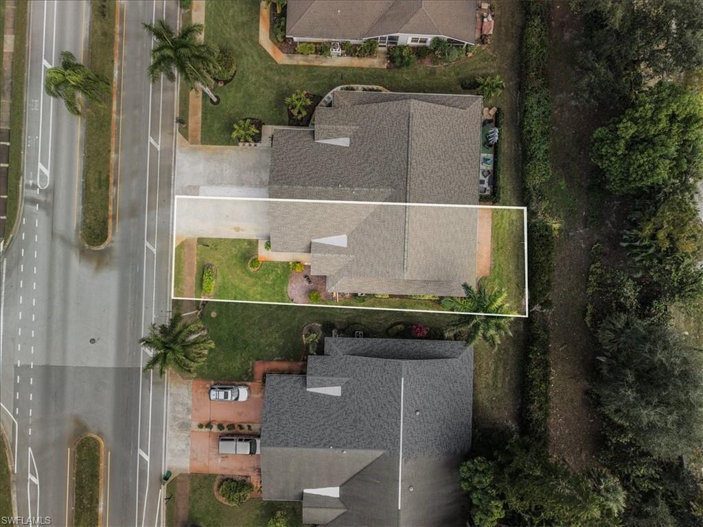 430 St Andrews Boulevard, Unit 6 Naples, FL 34113 - Photo 40 of 47 an aerial view of a house with a yard