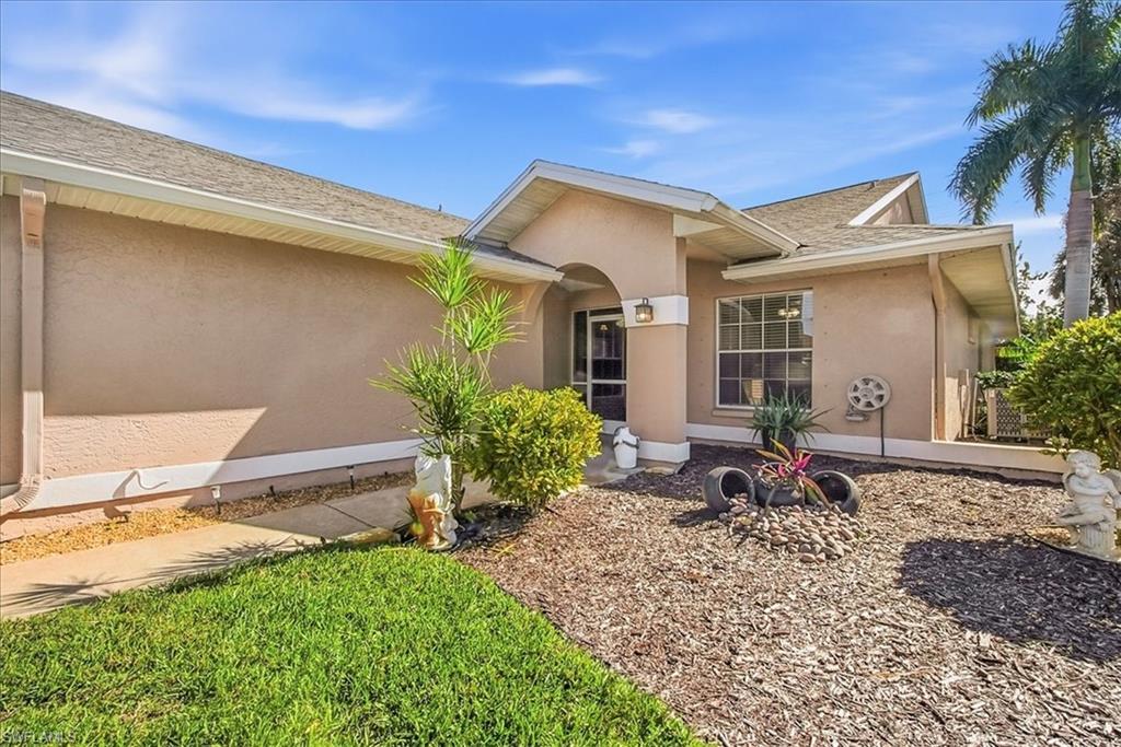 430 St Andrews Boulevard, Unit 6 Naples, FL 34113 - Photo 4 of 47 a backyard of a house with seating space