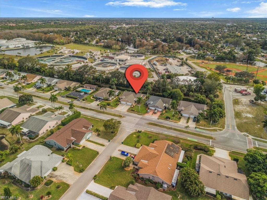 430 St Andrews Boulevard, Unit 6 Naples, FL 34113 - Photo 42 of 47 an aerial view of residential houses with outdoor space
