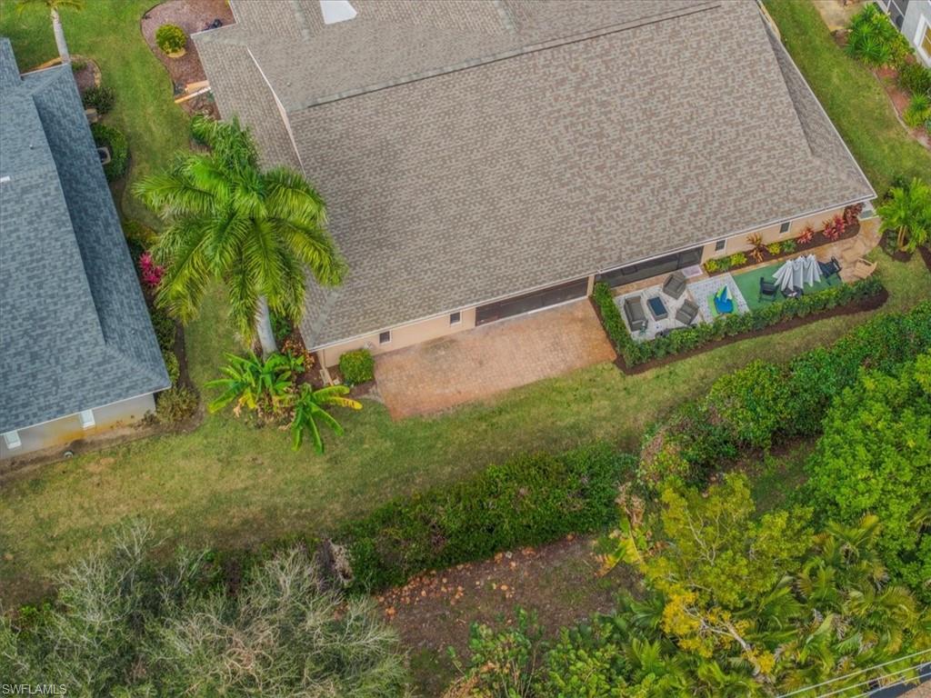 430 St Andrews Boulevard, Unit 6 Naples, FL 34113 - Photo 44 of 47 a view of an outdoor space and a yard