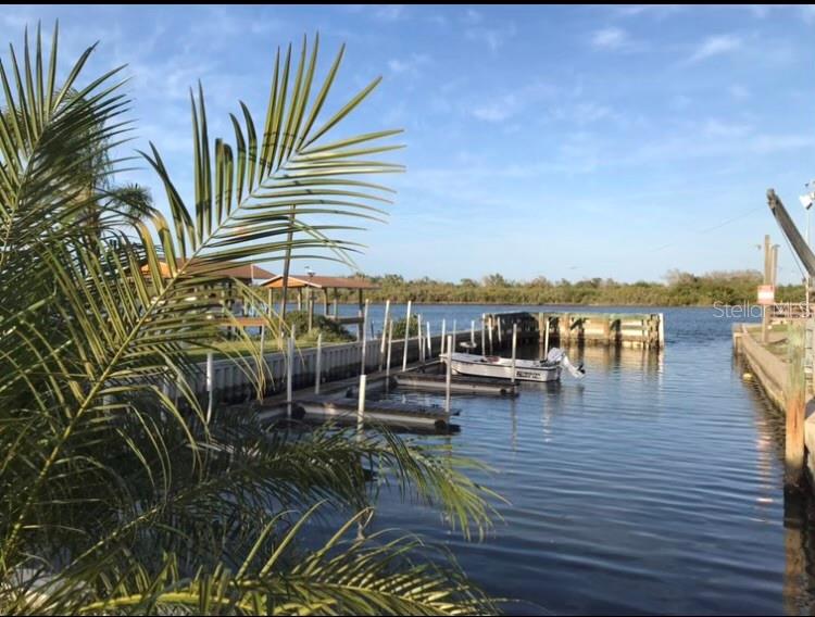 2201 South Ridgewood Avenue, Unit 23 Edgewater, FL 32141 - Photo 2 of 8 a view of a terrace with chairs