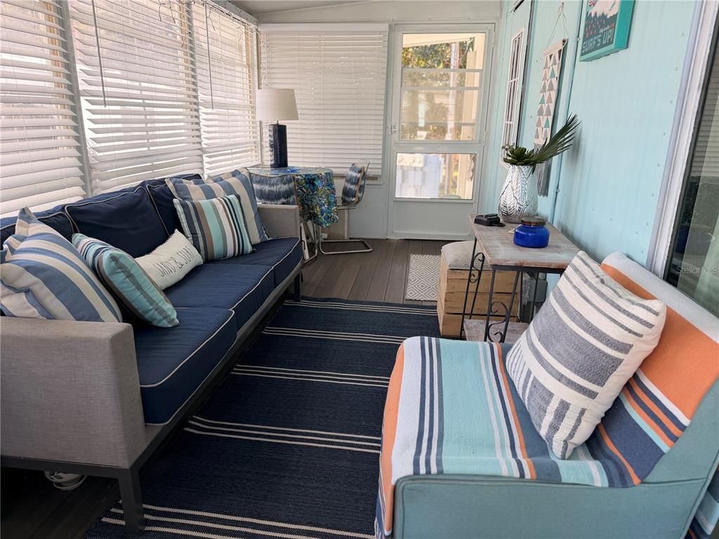 2201 South Ridgewood Avenue, Unit 23 Edgewater, FL 32141 - Photo 7 of 8 a living room with furniture and a window