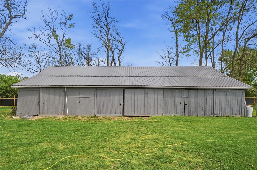 6155 North Union Road Clayton, OH 45315 - Photo 51 of 59 This spacious barn with a metal roof offers ample storage and utility for various needs.