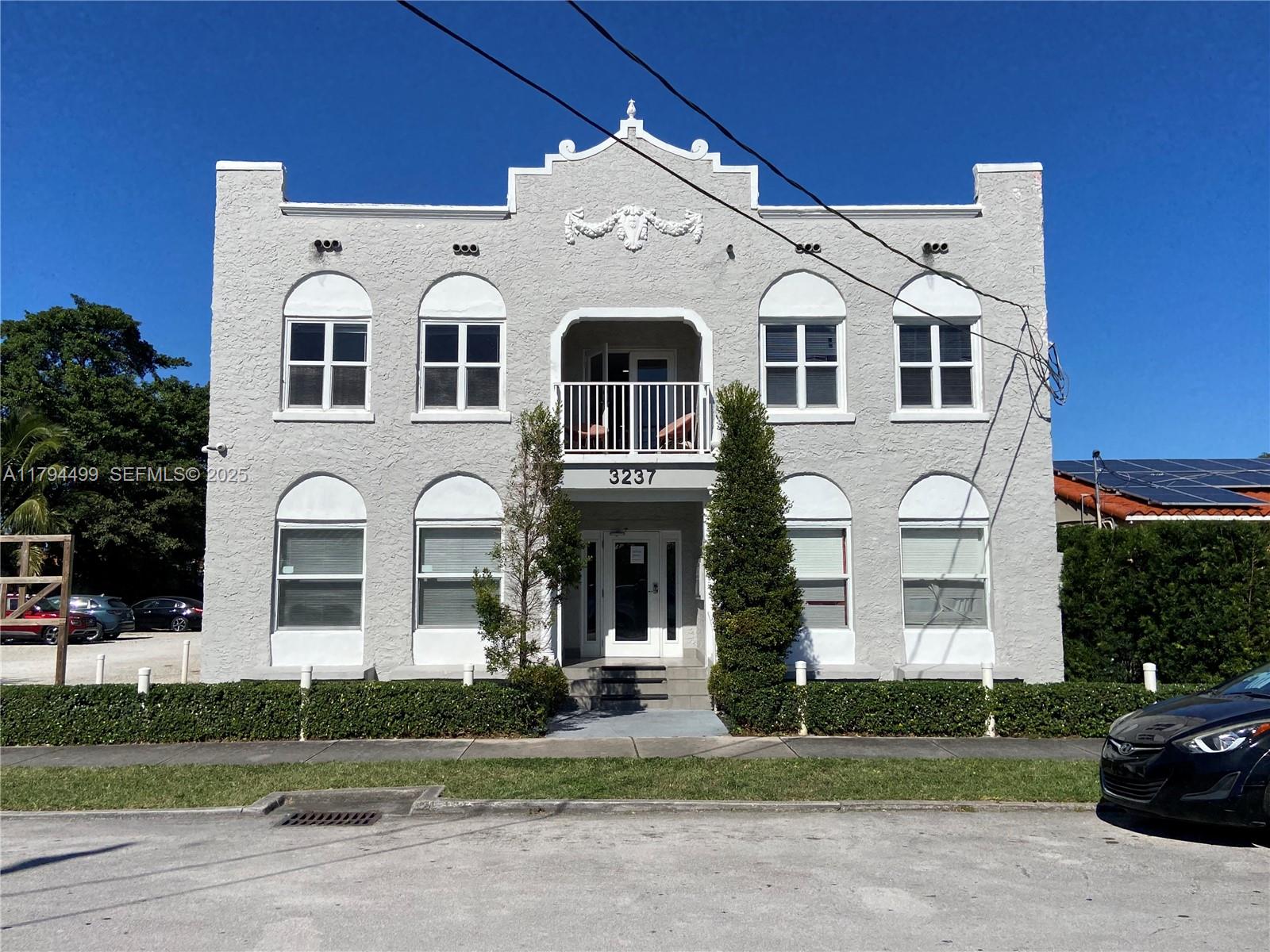 a front view of a white building