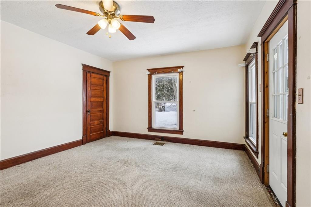 14 Elm Street Bessemer, PA 16112 - Photo 12 of 29 an empty room with chandelier fan