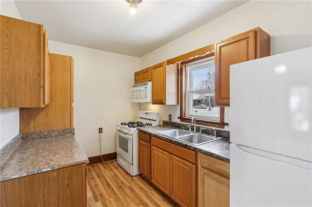 14 Elm Street Bessemer, PA 16112 - Photo 8 of 29 a kitchen with stainless steel appliances granite countertop a sink stove and refrigerator