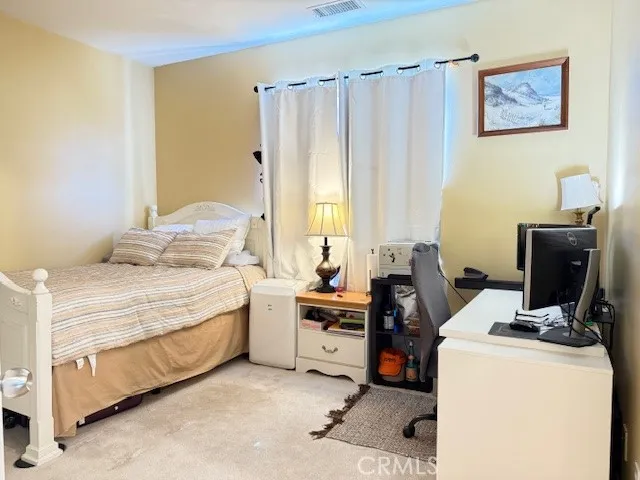 a room with a chair and wooden floor