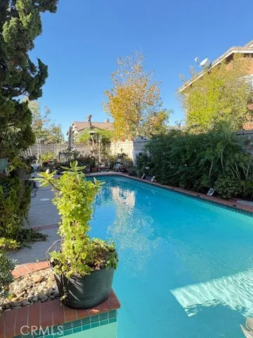 a view of a swimming pool with a patio