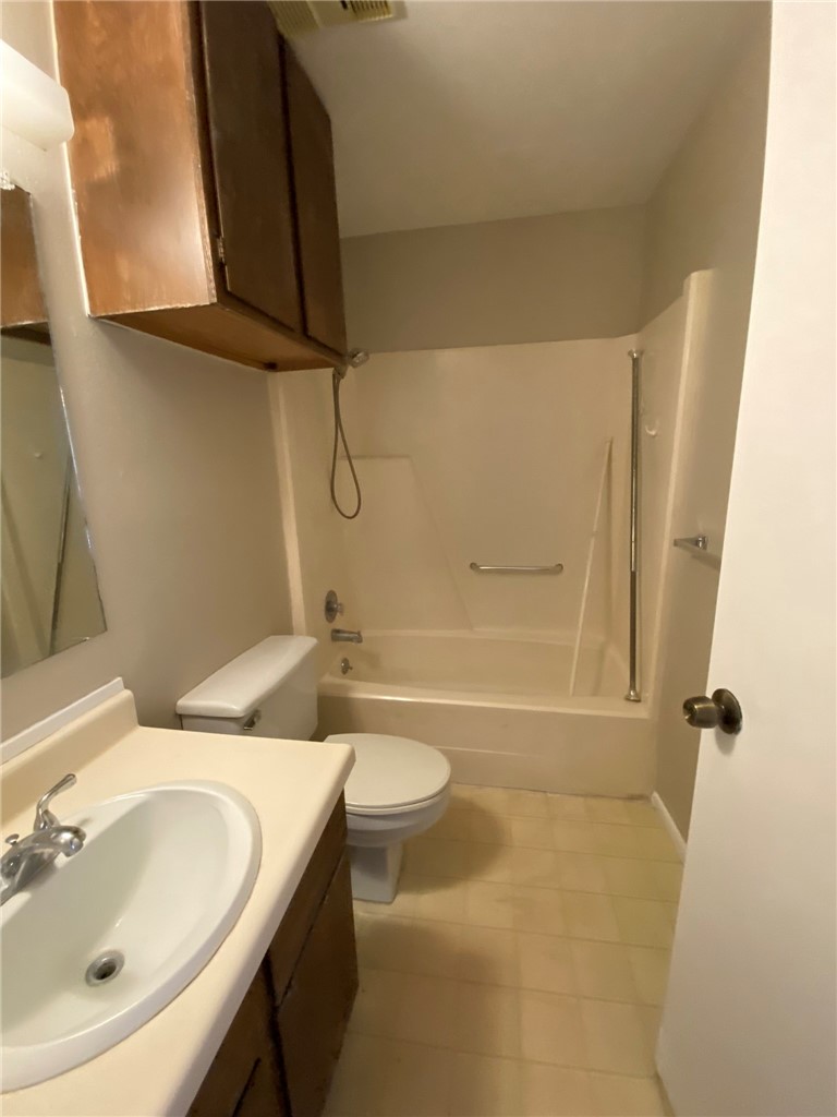 4229 Interstate Highway, Unit 3 Corpus Christi, TX 78410 - Photo 15 of 16 a bathroom with a sink a toilet and shower