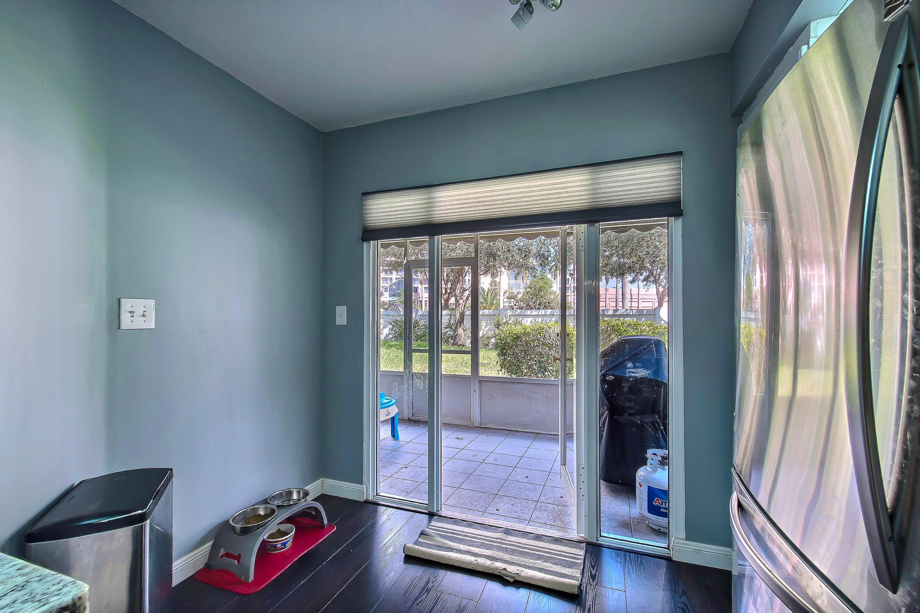 5116 Pointe Emerald Lane, Unit 5116 Boca Raton, FL 33486 - Photo 9 of 23 a room with window and wooden floor