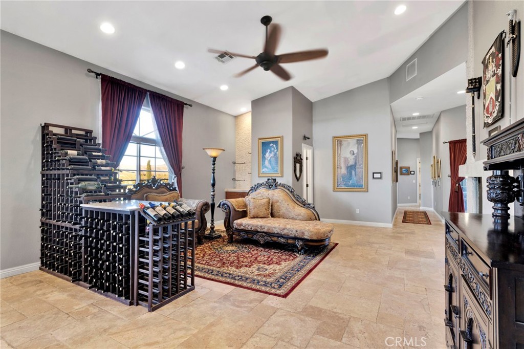 15485 Barker Road Apple Valley, CA 92307 - Photo 11 of 64 a living room with furniture a window and a chandelier