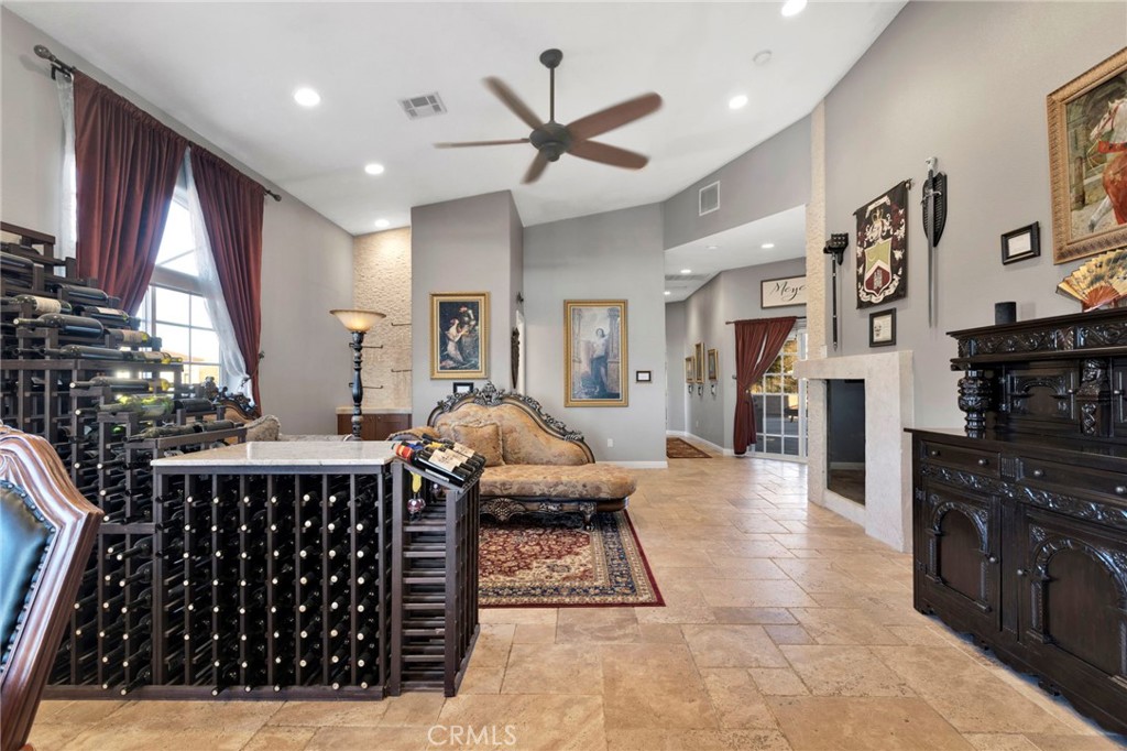 15485 Barker Road Apple Valley, CA 92307 - Photo 12 of 64 a living room with furniture a large window and a flat screen tv