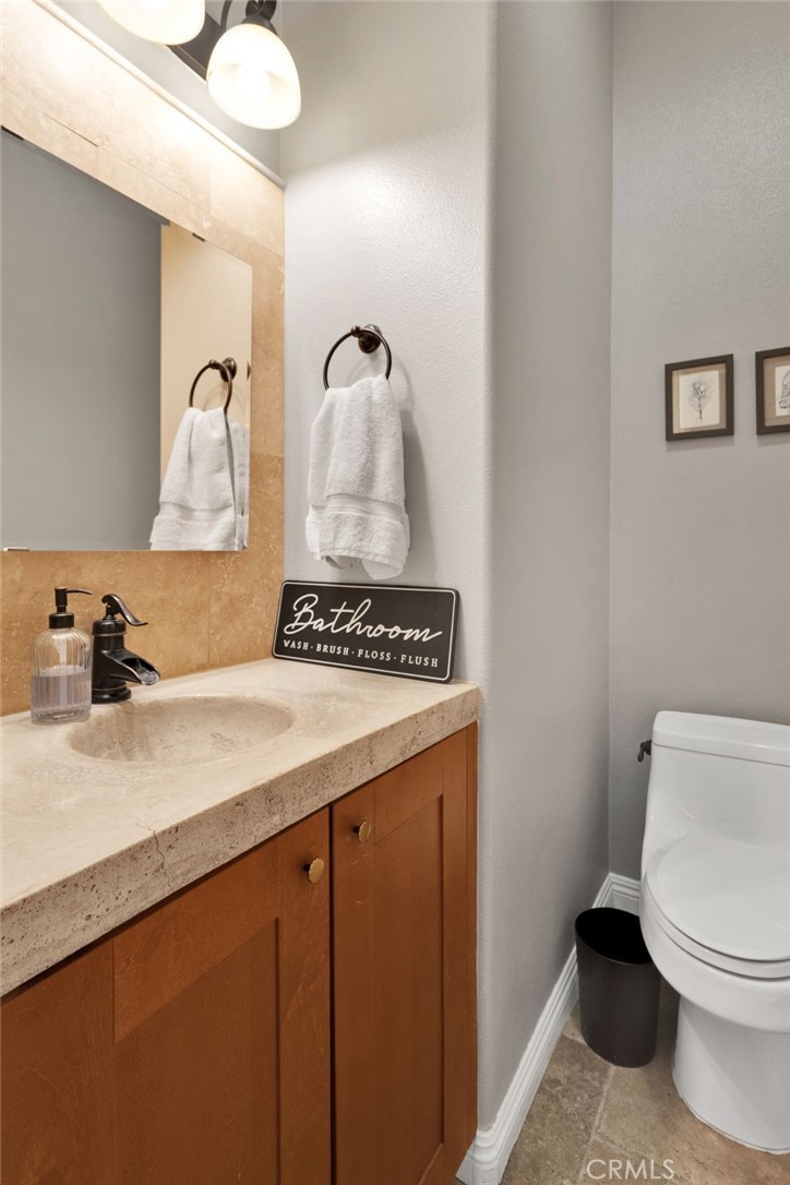 15485 Barker Road Apple Valley, CA 92307 - Photo 14 of 64 a bathroom with a sink and toilet