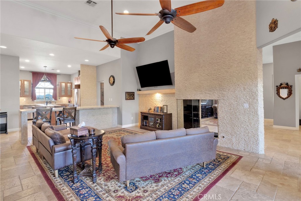 15485 Barker Road Apple Valley, CA 92307 - Photo 19 of 64 a living room with furniture and a flat screen tv