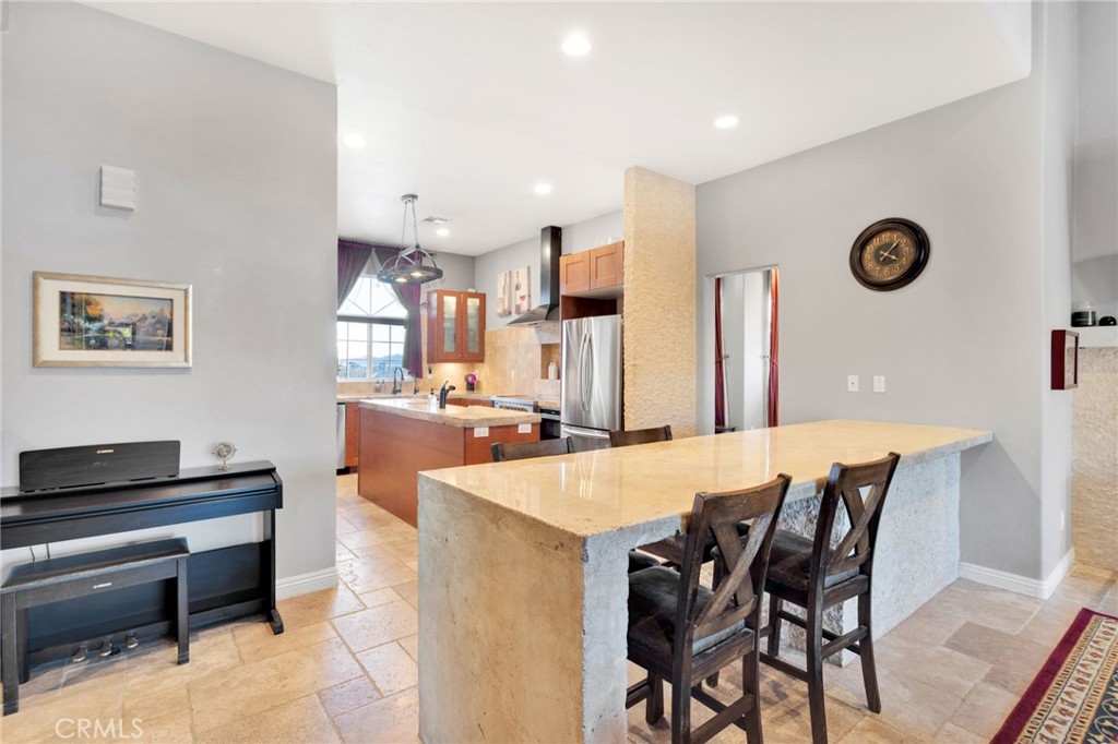 15485 Barker Road Apple Valley, CA 92307 - Photo 20 of 64 a large kitchen with a table and chairs