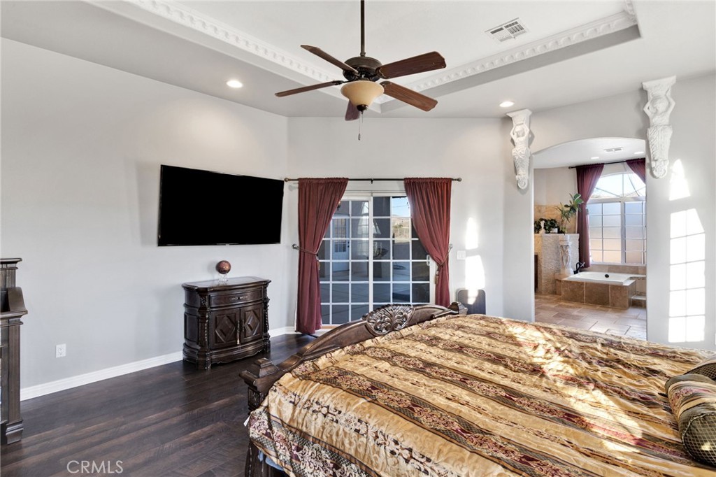 15485 Barker Road Apple Valley, CA 92307 - Photo 28 of 64 a bedroom with a bed and a flat screen tv