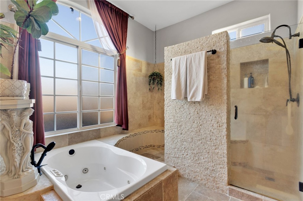 15485 Barker Road Apple Valley, CA 92307 - Photo 32 of 64 a bathroom with a bathtub and shower