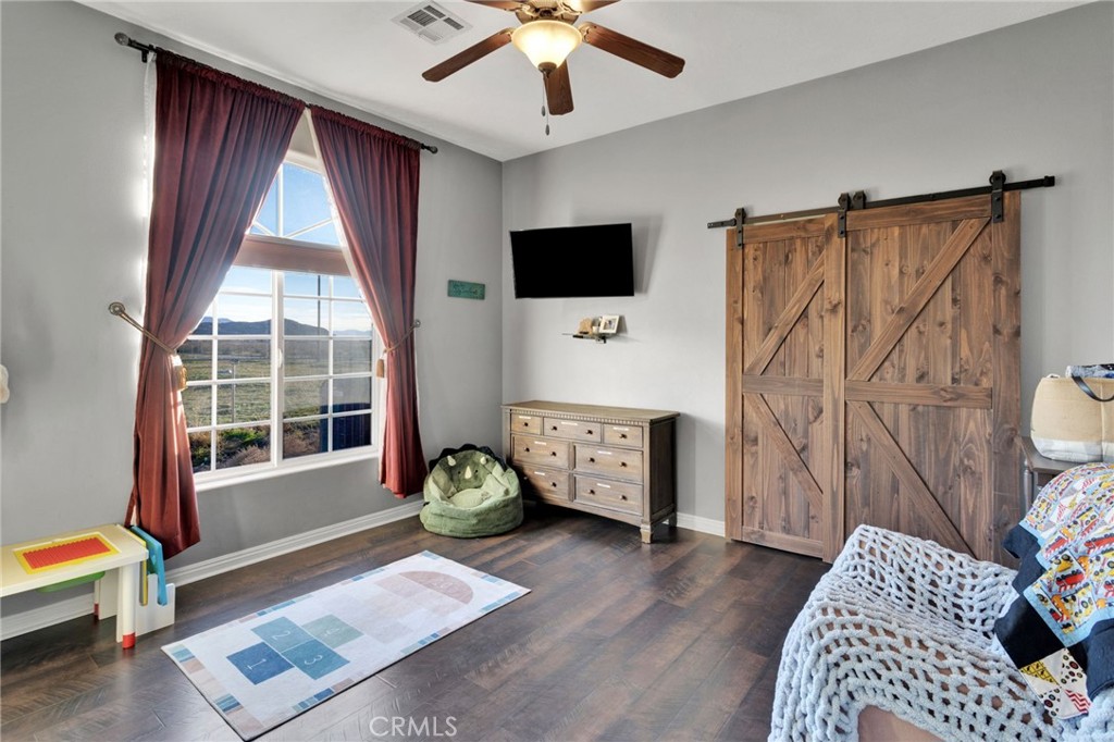 15485 Barker Road Apple Valley, CA 92307 - Photo 36 of 64 a living room with furniture and a window