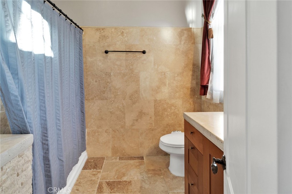 15485 Barker Road Apple Valley, CA 92307 - Photo 38 of 64 a bathroom with a sink a toilet and shower