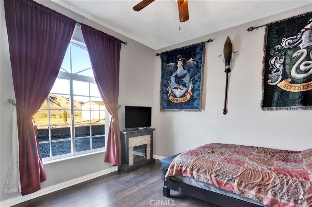 15485 Barker Road Apple Valley, CA 92307 - Photo 42 of 64 a bedroom with a bed and a window