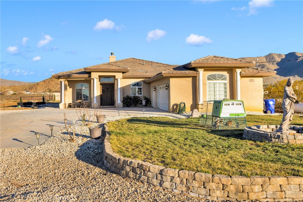 15485 Barker Road Apple Valley, CA 92307 - Photo 5 of 64 a view of a house with swimming pool and sitting area