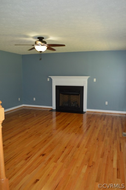 10755 Baltimore Road Ford, VA 23850 - Photo 6 of 23 a view of empty room with wooden floor and fireplace