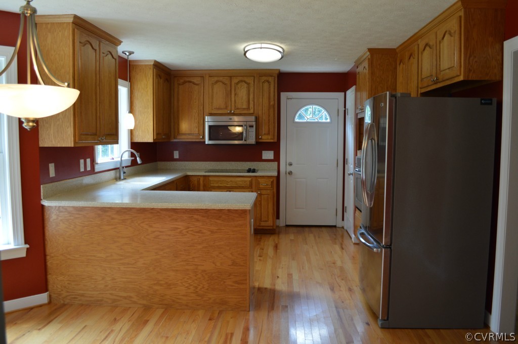 10755 Baltimore Road Ford, VA 23850 - Photo 8 of 23 a kitchen with granite countertop a refrigerator and a sink