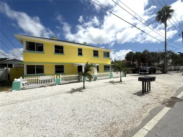 a view of a backyard of a house