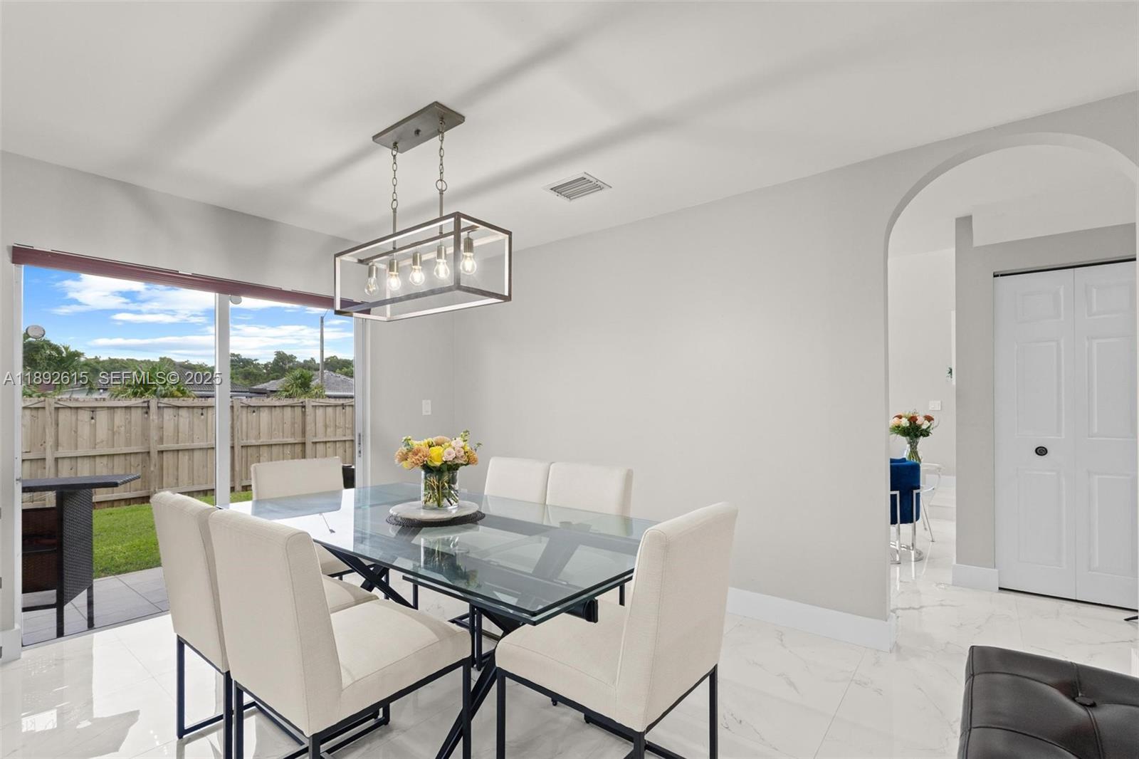 15025 Southwest 141st Terrace Miami, FL 33196 - Photo 11 of 34 a view of a dining room with furniture window and outside view