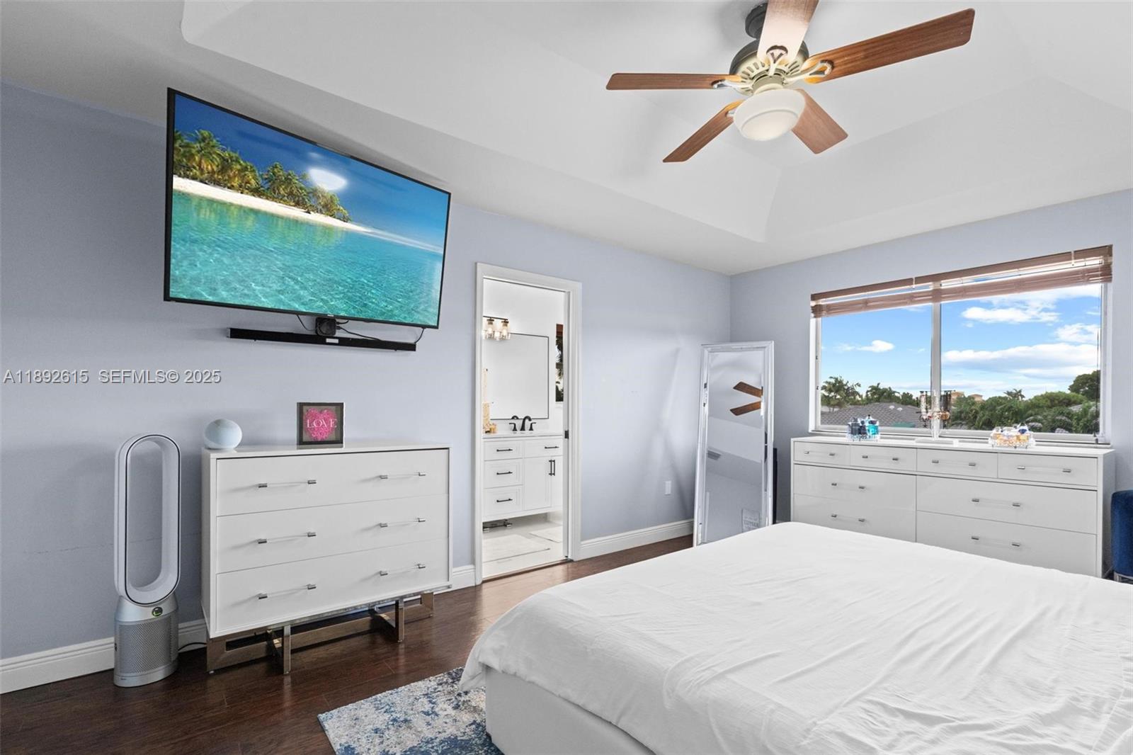 15025 Southwest 141st Terrace Miami, FL 33196 - Photo 12 of 34 a bedroom with a bed television on desk and a window