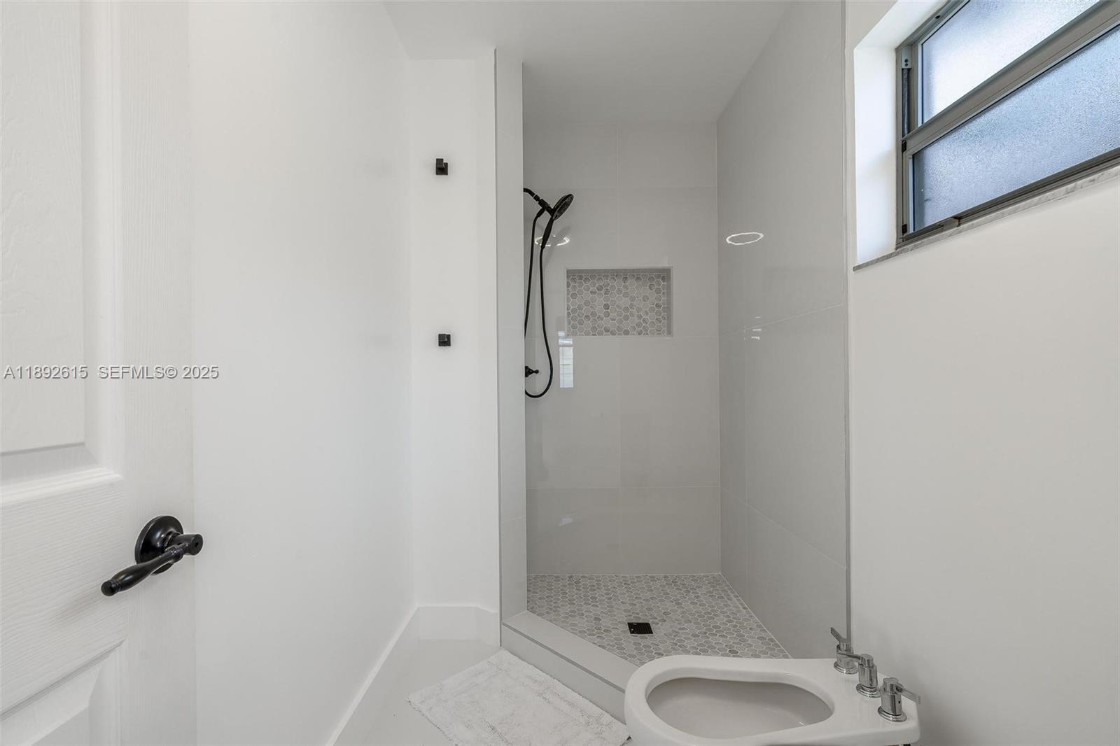 15025 Southwest 141st Terrace Miami, FL 33196 - Photo 16 of 34 a bathroom with a shower